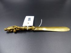 A FINELY CAST GILT BRONZE EROTIC HANDLED PAPER KNIFE FORMED AS ENTWINED ADAM AND EVE AND SERPENT.