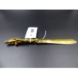A FINELY CAST GILT BRONZE EROTIC HANDLED PAPER KNIFE FORMED AS ENTWINED ADAM AND EVE AND SERPENT.