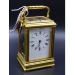 AN EARLY 20th.C.CARRIAGE CLOCK WITH WHITE ENAMEL DIAL SIGNED PLEISTER - GENEVA.