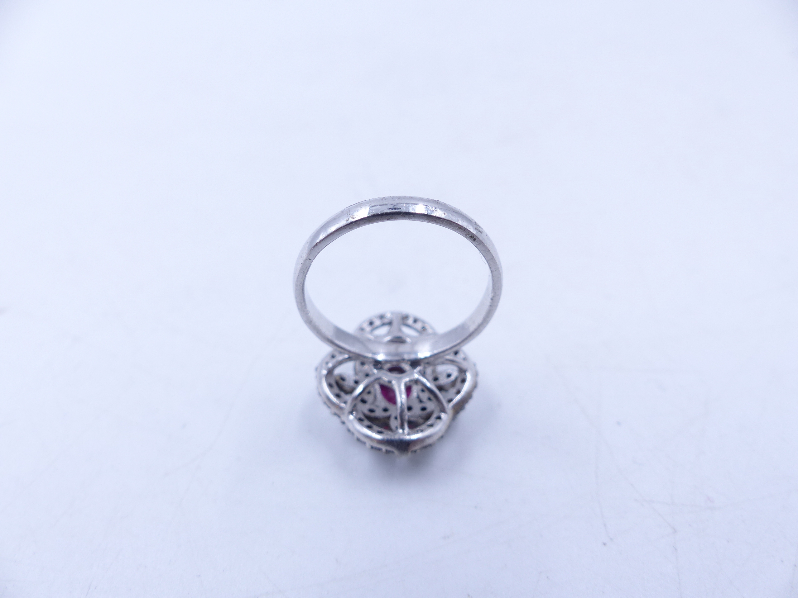 A PINK TOURMALINE AND DIAMOND OPEN WORK FILIGREE RING SET IN A WHITE METAL MOUNT,THE CENTRAL PINK - Image 10 of 17