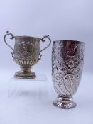 A VICTORIAN SILVER HALLMARKED TROPHY CUP, WITH CHASED FLORAL DECORATION AND ENGRAVING DATED 1889,