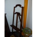 A CARVED OAK DISPLAY EASEL.