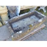 A LARGE 19th.C.CARVED STONE TROUGH OR GARDEN PLANTER. 136 x 67cms.