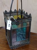 AN ANTIQUE BRASS FRAMED HALL LANTERN WITH LEADED STAINED GLASS PANELS. H.64cms.