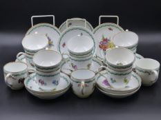 FOURTEEN MEISSEN FLORAL DECORATED SAUCERS AND THIRTEEN ASSORTED MEISSEN TEACUPS OF SIMILAR
