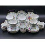 FOURTEEN MEISSEN FLORAL DECORATED SAUCERS AND THIRTEEN ASSORTED MEISSEN TEACUPS OF SIMILAR