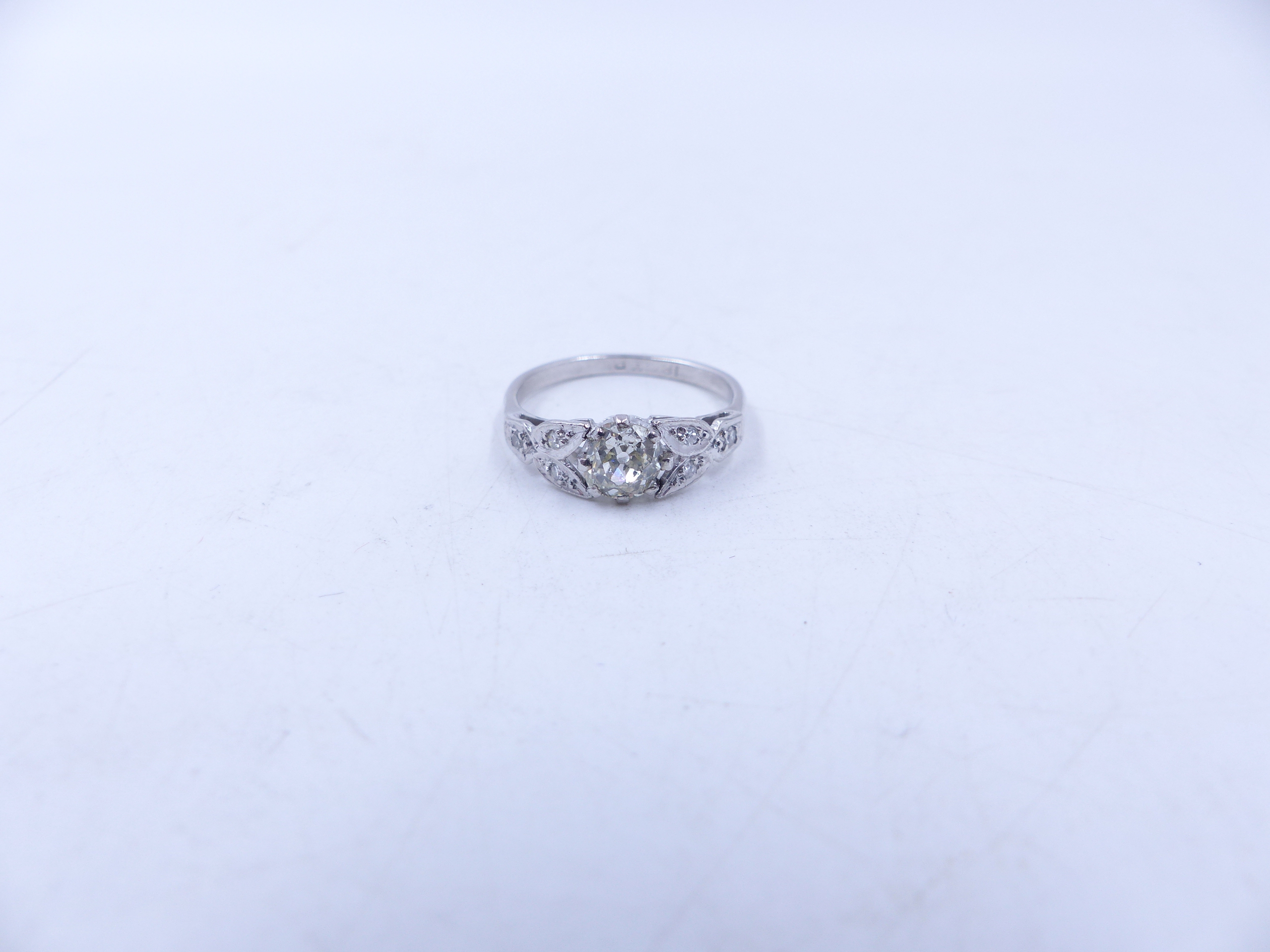 AN 18ct STAMPED OLD CUT DIAMOND RING. THE CENTRAL OLD CUT DIAMOND IS HELD IN AN EIGHT CLAW SETTING - Image 12 of 14