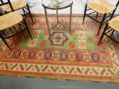 A TURKISH RUG OF CAUCASIAN KAZAK DESIGN. 210 x 148cms.