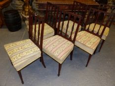 A SET OF SIX LATE GEORGIAN MAHOGANY DINING CHAIRS ON SQUARE TAPERED LEGS WITH SPADE FEET.