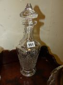 A PAIR OF CUT GLASS DECANTERS. H.33cms. AND A PAIR OF IRISH STYLE GLASS VASES. H.17cms. (4)