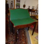 AN 18th.C.MAHOGANY FOLD OVER CARD TABLE OF SERPENTINE OUTLINE ON FLUTED SQUARE SECTION LEGS. W.86