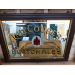 AN IND COOPE'S BURTON ALES ADVERTISING MIRROR IN OAK FRAME. 90 x 57cms.