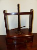 AN ANTIQUE MAHOGANY BOOK PRESS.