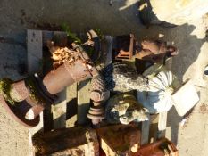 A CAST IRON GARDEN WATER PUMP, AN IRON FIGURE OF A DUTCH BOY, TWO FINIALS,ETC.