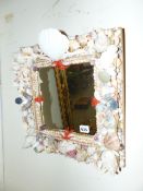 A SMALL SHELL ENCRUSTED WALL MIRROR. 38 x 42cms.