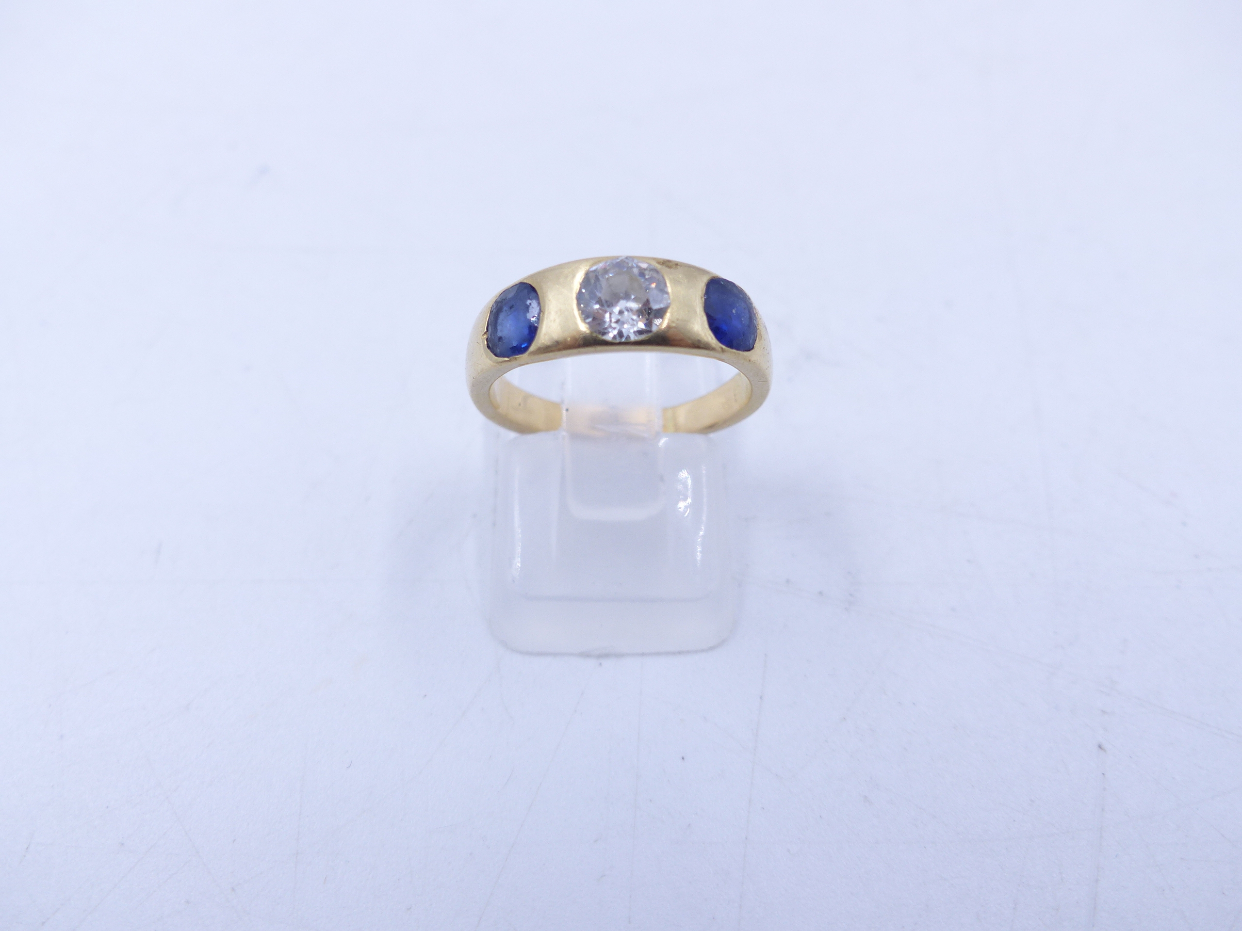 AN 18 STAMPED YELLOW GOLD SAPPHIRE AND DIAMOND THREE STONE TRADITIONAL GYPSY-SET RING. THE CENTRE - Image 7 of 9