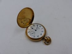 A 9ct YELLOW GOLD FULL HUNTER WALTHAM USA POCKET WATCH, BIRMINGHAM.