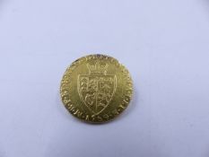 A 1789 GEORGE III FULL SPADE GUINEA GOLD COIN.