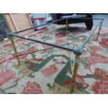 A LARGE BRASS FRAMED GLASS TOP COFFEE TABLE. L.130 x W.70cms.