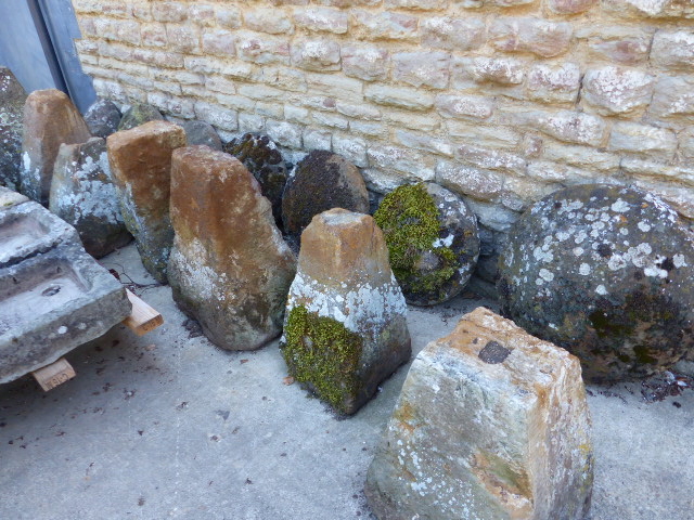 A GROUP OF SEVEN 19th.C.STADDLE STONES WITH TOPS.