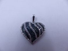 A 9ct WHITE GOLD PAVE SET BLUE AND WHITE DIAMOND HEART PENDANT. MEASUREMENTS 3cms X 2.6cms, WEIGHT