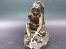 A LATE 19th.C.GRAND TOUR BRONZE FIGURE OF A MEDITERRANEAN FISHER BOY WITH TURTLE SEATED ON NETS,