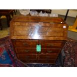 AN 18th.C. AND LATER WALNUT AND INLAID WRITING BUREAU WITH FITTED INTERIOR OVER THREE LONG