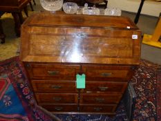 AN 18th.C. AND LATER WALNUT AND INLAID WRITING BUREAU WITH FITTED INTERIOR OVER THREE LONG