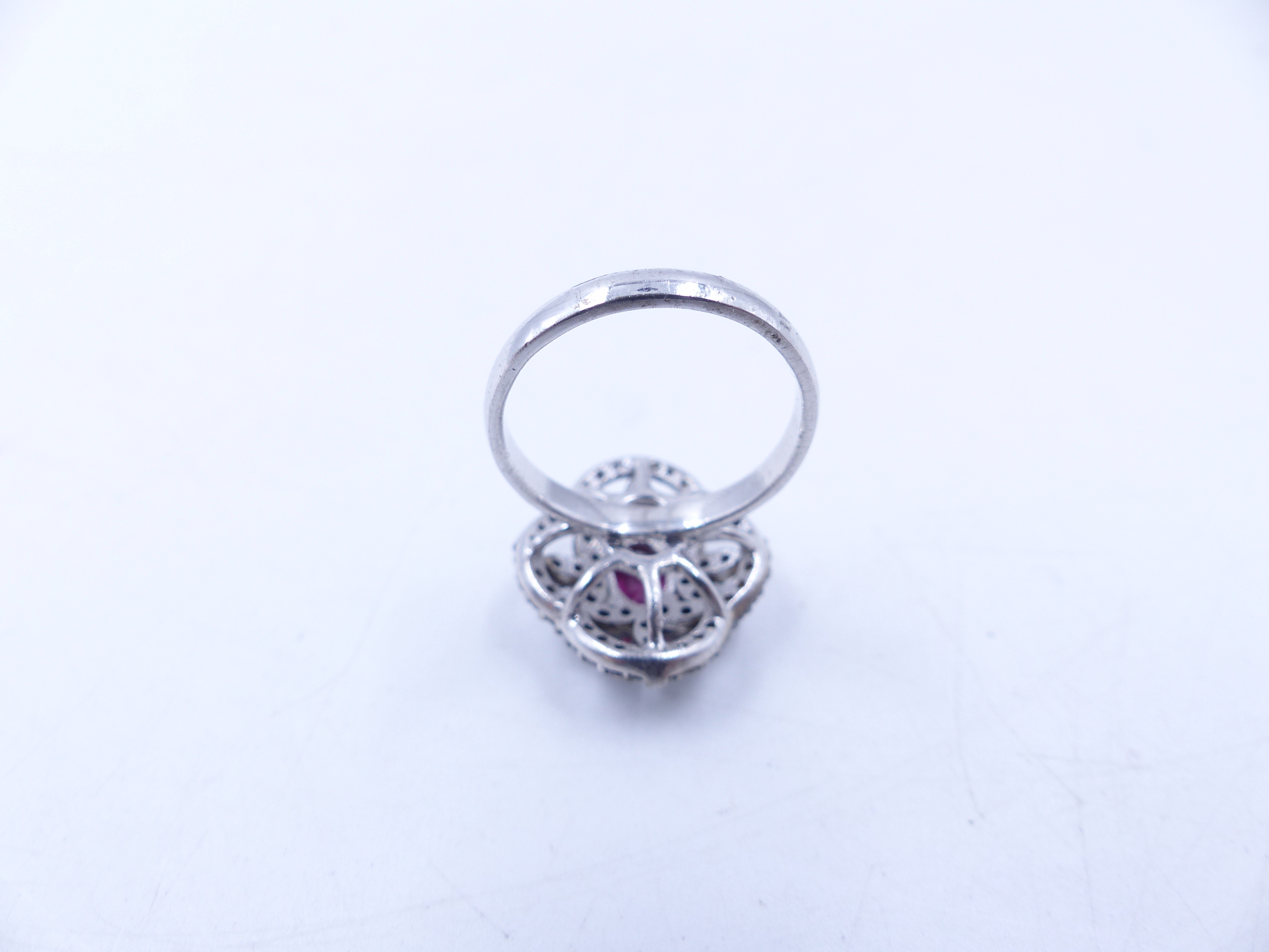 A PINK TOURMALINE AND DIAMOND OPEN WORK FILIGREE RING SET IN A WHITE METAL MOUNT,THE CENTRAL PINK - Image 9 of 17