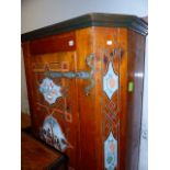 A CONTINENTAL PINE HALL CABINET WITH PAINTED DECORATION AND SHELVED INTERIOR WITH SMALL DRAWER TO