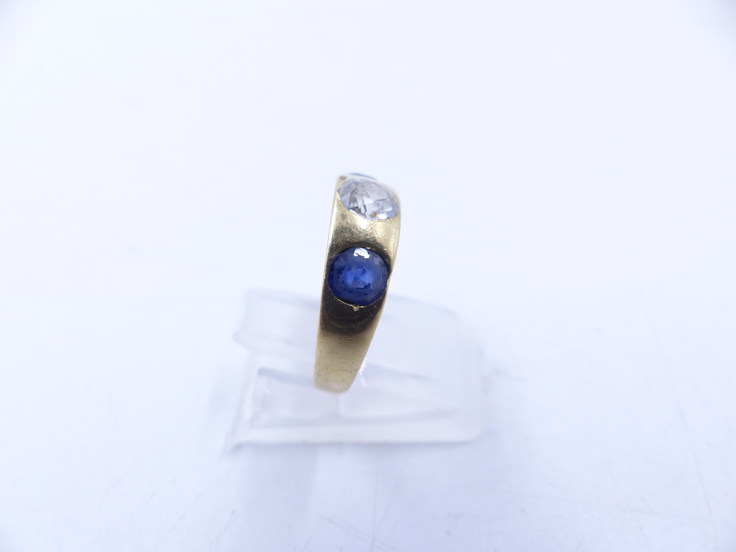 AN 18 STAMPED YELLOW GOLD SAPPHIRE AND DIAMOND THREE STONE TRADITIONAL GYPSY-SET RING. THE CENTRE - Image 4 of 9