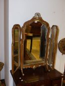 A QUEEN ANNE STYLE WALNUT FRAMED TRIPTYCHE DRESSING TABLE MIRROR.