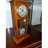 AN EARLY 20th.C.GERMAN MANTLE CLOCK IN ARTS AND CRAFTS STYLE, THE WALNUT CASE WITH GLAZED PANELS AND