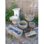 A BOOT SCRAPER, AN ANTIQUE SMALL MORTAR AND VARIOUS DECORATIVE GARDEN URNS AND PLANTERS.