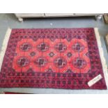 TWO AFGHAN BOKHARA RUGS. LARGEST. 132 x 90cms. (2)