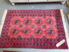 TWO AFGHAN BOKHARA RUGS. LARGEST. 132 x 90cms. (2)