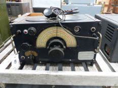 A VINTAGE , POSSIBLY AIR MINISTRY, RADIO RECIEVER COMPLETE WITH HEADPHONES.