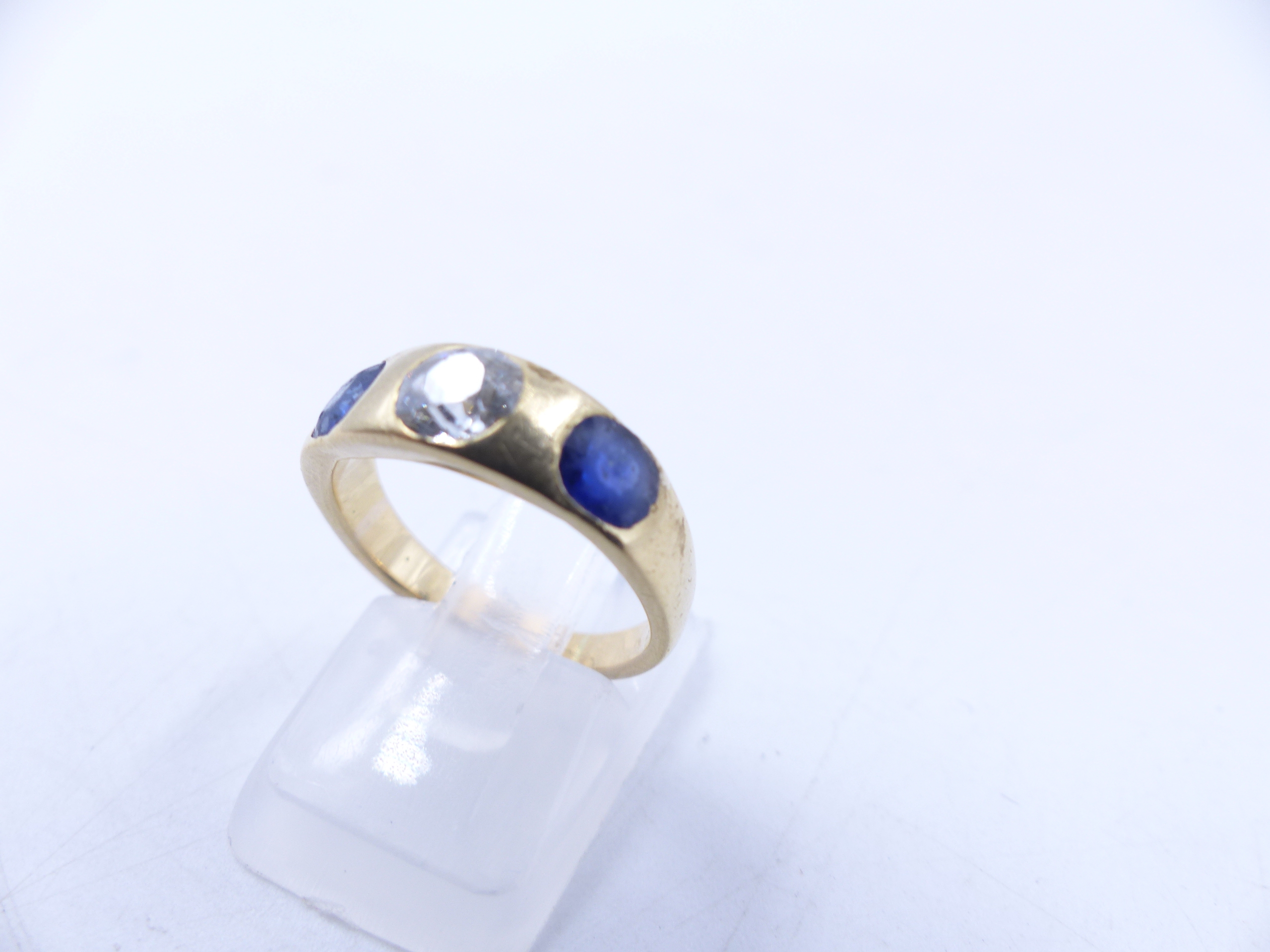 AN 18 STAMPED YELLOW GOLD SAPPHIRE AND DIAMOND THREE STONE TRADITIONAL GYPSY-SET RING. THE CENTRE - Image 2 of 9