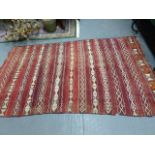 A TRIBAL FLAT WEAVE RUG. 298 x 170cms AND ANOTHER. 162 x 63cms. (2)