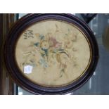 A PAIR OF GILT FRAMED OVAL GEORGIAN SILKWORK FLORAL PANELS. 23 x 16cms TOGETHER WITH A LARGER