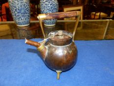 AN ARTS AND CRAFTS COPPER KETTLE BY BENHAM & FROUD.