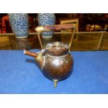 AN ARTS AND CRAFTS COPPER KETTLE BY BENHAM & FROUD.