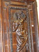 AN IMPRESSIVE PAIR OF 17th/18th.C.CARVINGS DEPICTING CLASSICAL FIGURES, LATER MOUNTED AS DOORS. H.