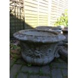 TWO PAIRS OF LARGE GARDEN URNS ON SHAPED PEDESTAL SUPPORTS.