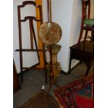 A REGENCY PAINT DECORATED POLE SCREEN WITH NEEDLEPOINT PANEL.