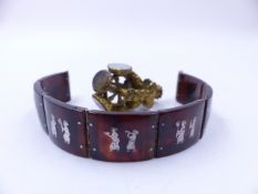 A VINTAGE TORTOISE SHELL AND WHITE METAL INLAID SIAM ART PANEL BRACELET TOGETHER WITH A ROTATING WAX