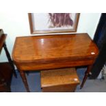A REGENCY MAHOGANY AND INLAID FOLD OVER CARD TABLE ON TURNED TAPERED LEGS. W.92cms.