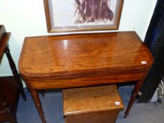 A REGENCY MAHOGANY AND INLAID FOLD OVER CARD TABLE ON TURNED TAPERED LEGS. W.92cms.