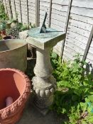 A LARGE COMPOSITE STONE COLUMN MOUNTED WITH BRONZE SUNDIAL.