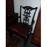 AN ANTIQUE CHIPPENDALE STYLE MAHOGANY ARMCHAIR OF GENEROUS PROPORTIONS.